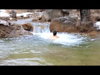 bathing in the mountain river.